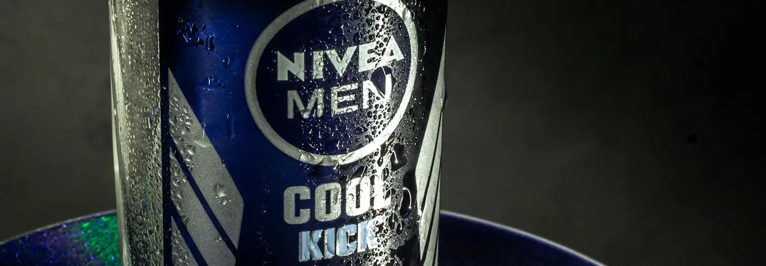 close-up product photography of Nivea Men Cool Kick deodorant can with water droplets