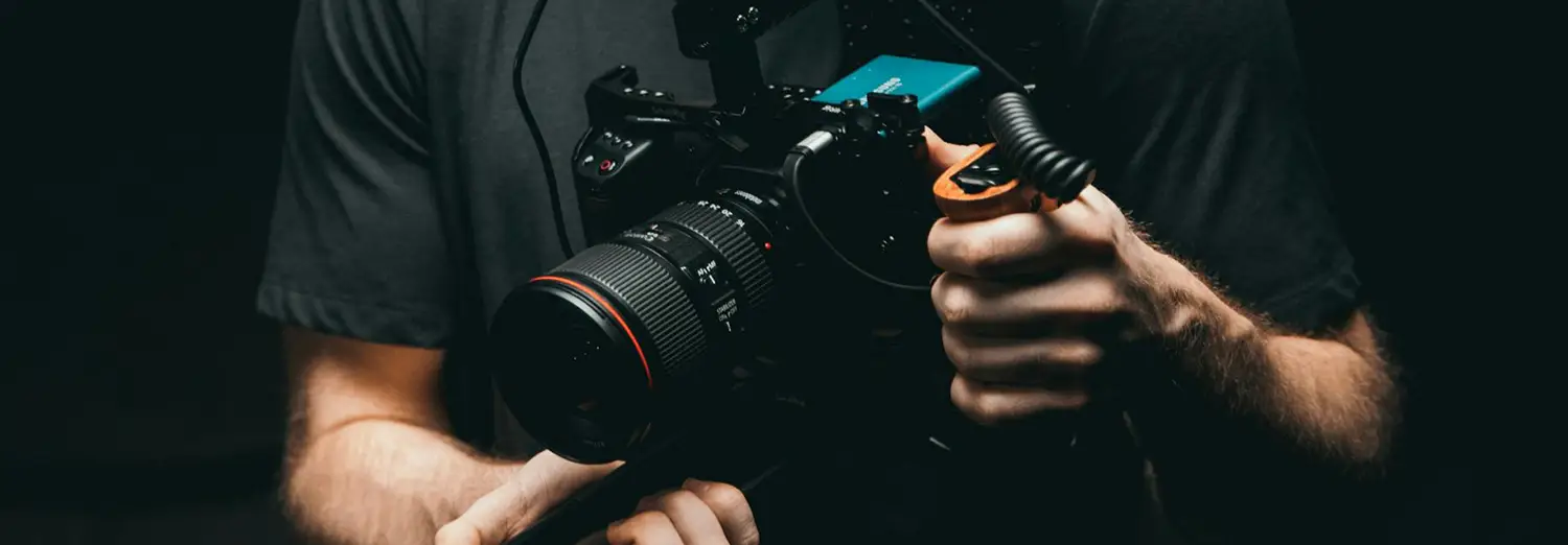 professional product photography of cinematic camera rig being adjusted