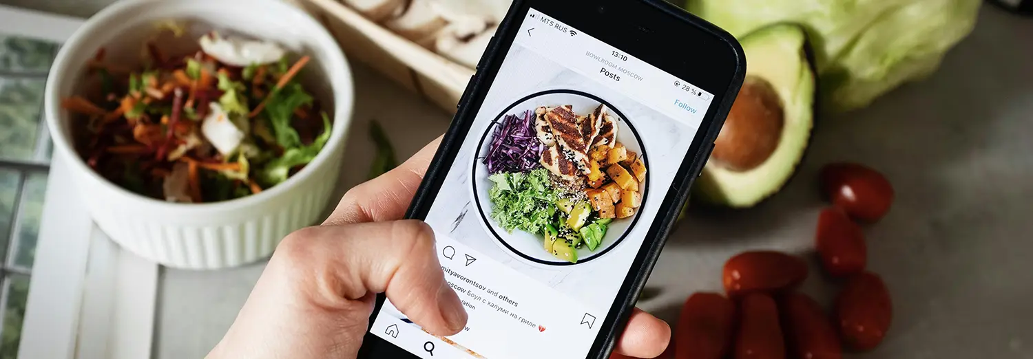 food photography of vibrant salad bowl displayed on smartphone screen