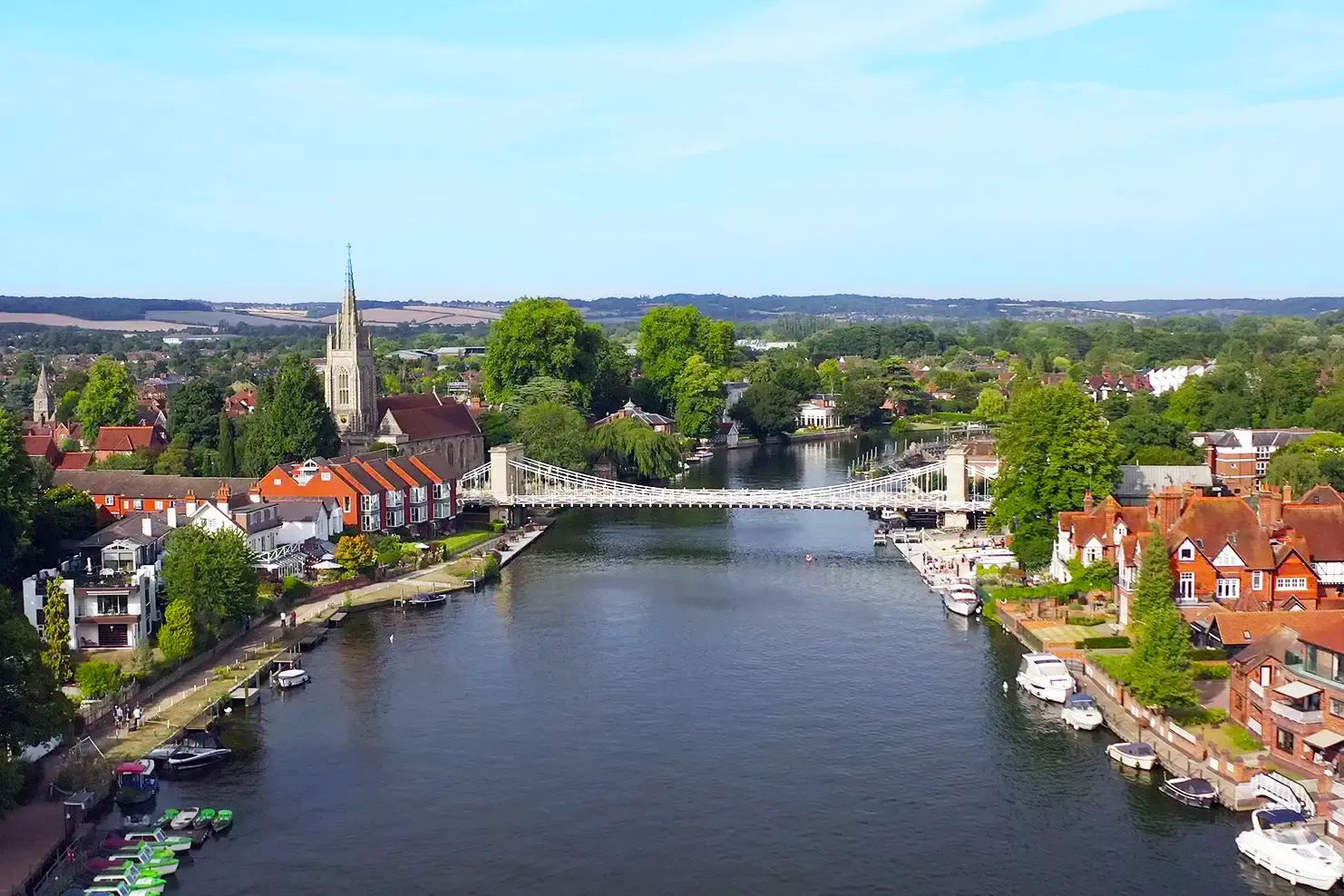 aerial drone photography of river with bridge and surrounding town