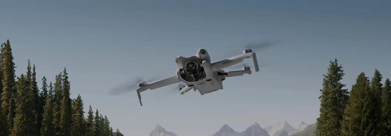 drone photography capturing flying drone against mountain backdrop